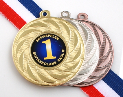 Medalj med idrottsmotiv och text